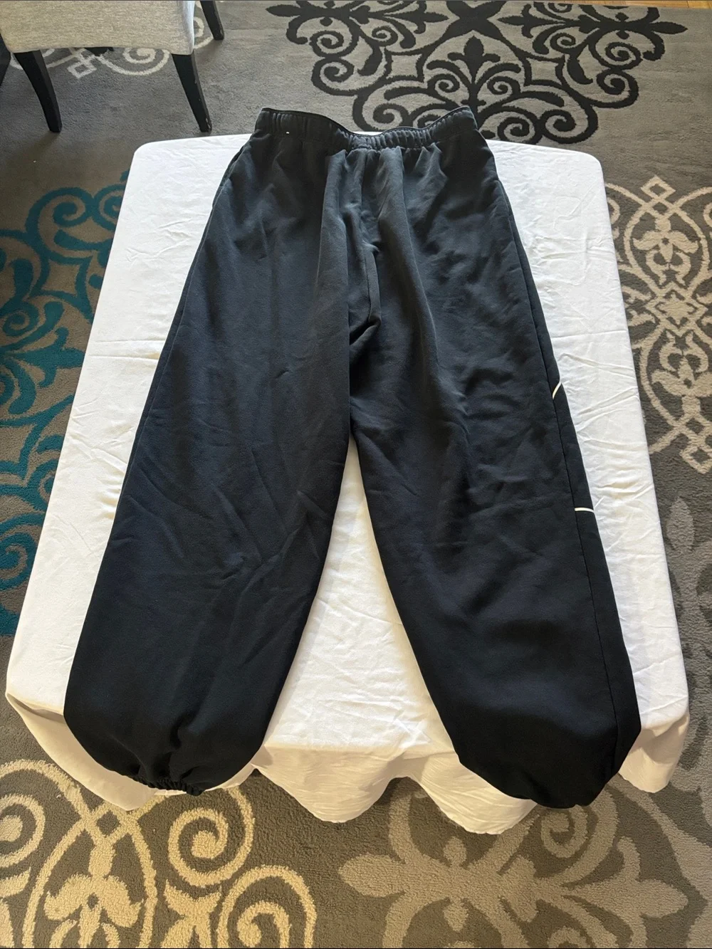 Nike Black Jogger Sweatpants with White Swoosh Graphics